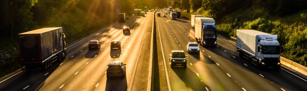 View over busy motorway with traffic at dusk