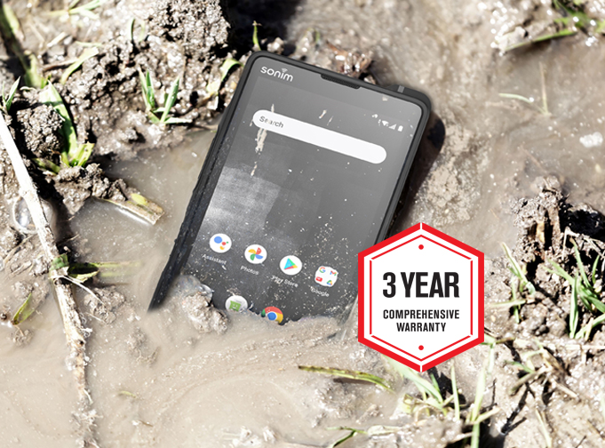 Photo of the Sonim XP10 5G smartphone in a muddy puddle with Sonim 3-year warranty badge