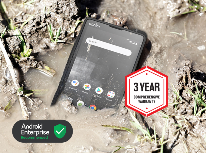 Photo of the Sonim XP10 5G smartphone in a muddy puddle with Sonim 3-year warranty badge and Android Enterprise Recommended badge overlaid.