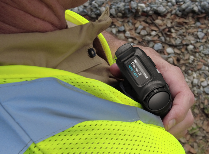 User in fluoro vest using the TAIT AXIOM Wearable